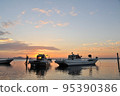 Fishing boat and sunrise 95390386