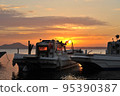 Fishing boat and sunrise 95390387