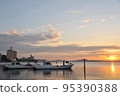 Fishing boat and sunrise 95390388