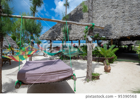 Paradise place. Beach holidays in a chic Asian-style hotel. Wooden beds 95390568