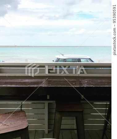 Sea view cafe terrace seats 95390591