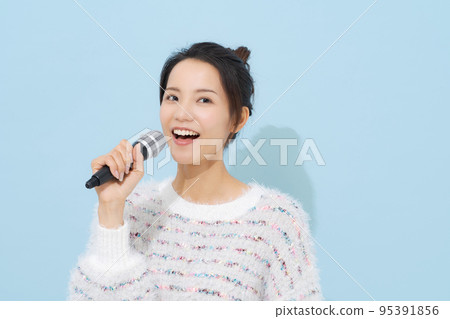 Woman singing a song Woman singing a song 95391856
