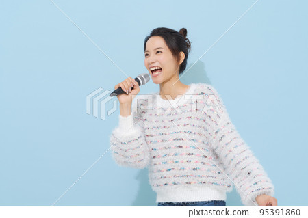 Woman singing a song Woman singing a song 95391860