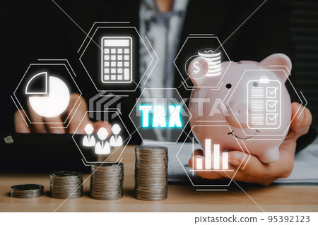 Tax concept for business, Business woman using calculator to complete Individual income tax return form online for tax payment, Data analysis, paperwork, financial research, report, Calculation tax. Tax concept for business, Business woman using calculator to complete Individual income tax return form online for tax payment, Data analysis, paperwork, financial research, report, Calculation tax. 95392123