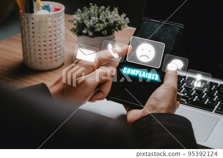 Complaints concept, Business woman using smartphone with complaints icon on vr screen, dissatisfaction from product or service problem, angry feedback from client. 95392124