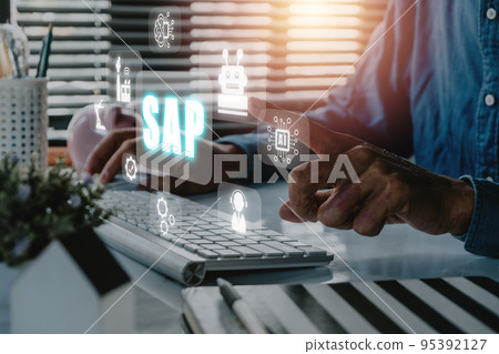 SAP - Business process automation software and management software (SAP), Person hand typing on keyboard with ERP enterprise resources planning system concept on virtual screen. 95392127