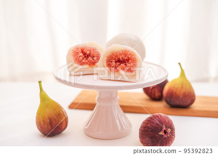 Fig Daifuku cross section on a cake stand 95392823