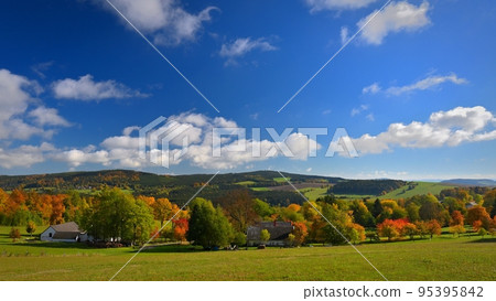 Beautiful autumn nature with landscape in the Czech Republic. Colorful trees with blue sky and sun. Background for fall and environment. Beautiful autumn nature with landscape in the Czech Republic. Colorful trees with blue sky and sun. Background for fall and environment. 95395842