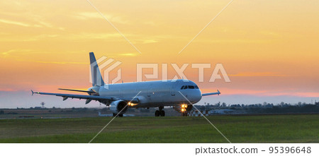Passenger plane taxies onto the runway Passenger plane taxies onto the runway 95396648