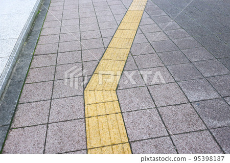 After the rain, the town, the tactile blocks and the sidewalk in a light rain After the rain, the town, the tactile blocks and the sidewalk in a light rain 95398187