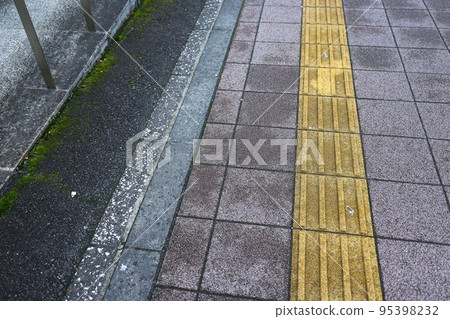 After the rain, the town, the tactile blocks and the sidewalk in a light rain After the rain, the town, the tactile blocks and the sidewalk in a light rain 95398232