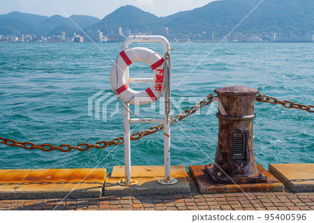 Rescue floats and chain fences on coastal roads 95400596