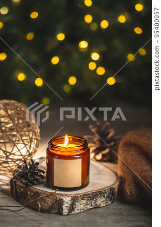 Holiday candle in a glass jar with label mock up 95400957