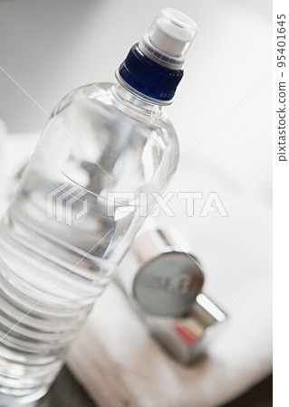 Bottle of water and a towel 95401645