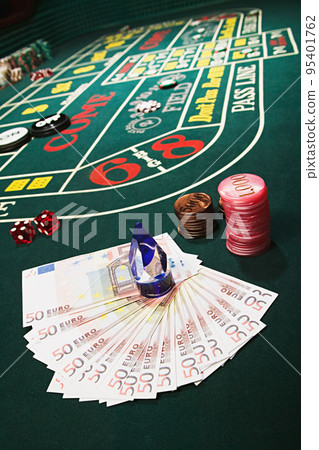 Money and chips on a craps table 95401762