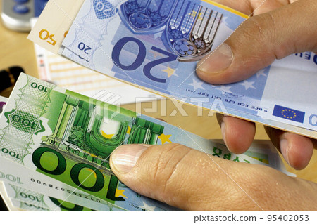 Businessman counts money in hands. Businessman counts money in hands. 95402053