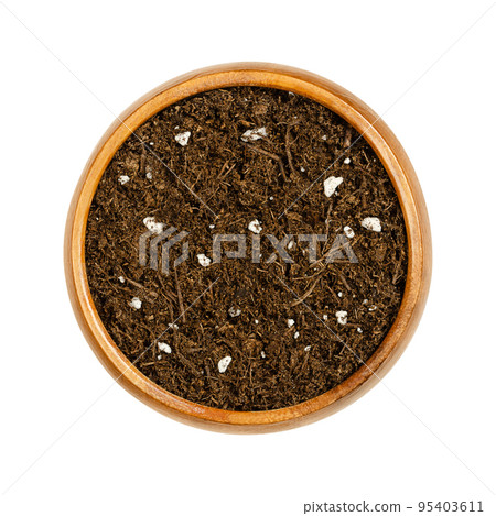 Organic potting compost, in a wooden bowl. Soft soil, growing medium and culture substrate, for sowing. Made of moderately decomposed raised bog peat, bark humus, wood fibers, sand and NPK-fertilizer. 95403611