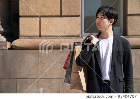 Young man shopping in Kobe Young man shopping in Kobe 95404707