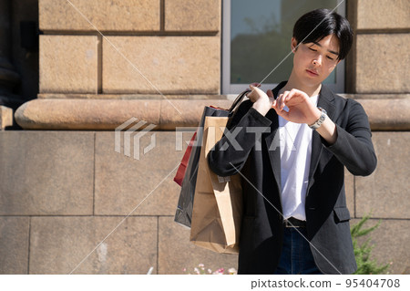 Young man shopping in Kobe Young man shopping in Kobe 95404708