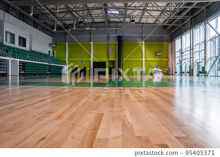 interior of an empty sports hall without anyone before playing. Basketball court. 95405371
