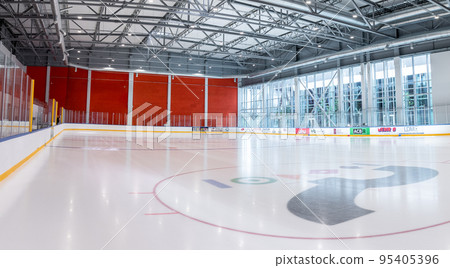 Riga, Latvia. July 10, 2022. Empty hockey rink sport arena ice and light Riga, Latvia. July 10, 2022. Empty hockey rink sport arena ice and light 95405396