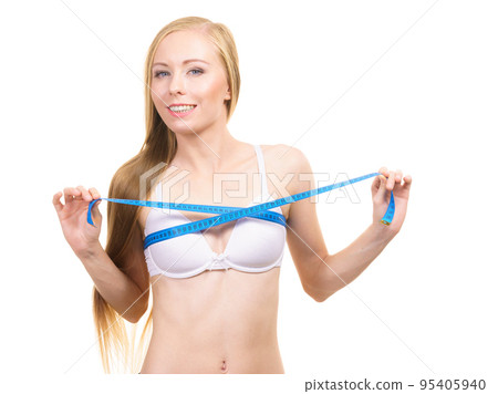 Girl measuring her chest breasts bust size 95405940