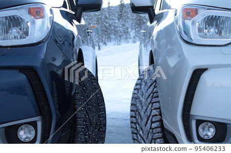 Winter drive safety. Studded tires and non studless tires detailed stock photo 95406233