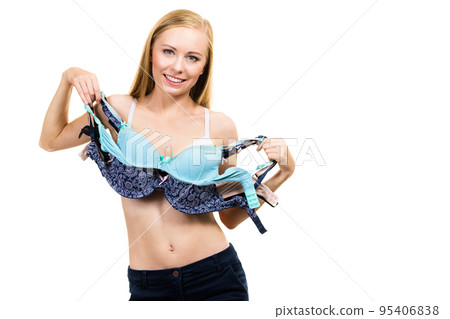 Woman holds bras, choosing Woman holds bras, choosing 95406838
