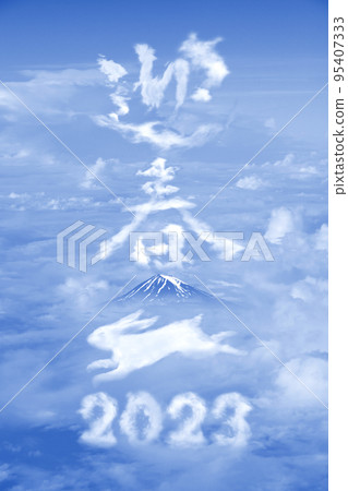 The characters "2023" and "Welcome to the New Year" drawn with clouds and a jumping "rabbit" + the dignified background of Mt. Fuji. 95407333