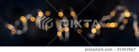 Fairy lights, blurred led garland panorama, overhead flat lay shot Fairy lights, blurred led garland panorama, overhead flat lay shot 95407667