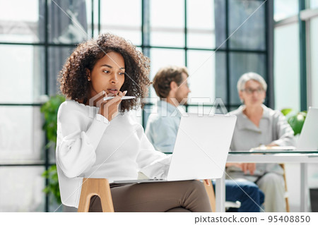 business woman is working on a laptop in the office . business woman is working on a laptop in the office . 95408850