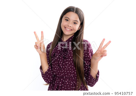 Portrait of funny cheerful teenager child girl showing v-sign isolated over white background. Portrait of happy smiling teenage child girl. 95410757