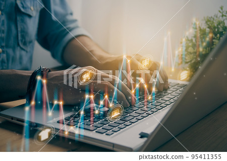 Casual Businessman Typing Laptop and Slant Online Products Color Stock Bar Chart in Vintage Tone Casual Businessman Typing Laptop and Slant Online Products Color Stock Bar Chart in Vintage Tone 95411355