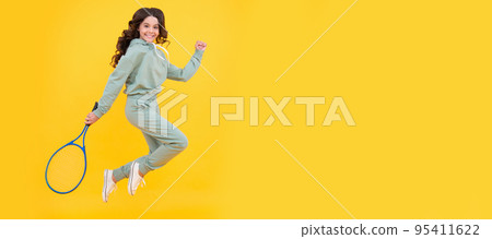 happy energetic child jump in sportswear with squash racquet on yellow background, sport success. Horizontal poster of isolated child face, banner header, copy space. happy energetic child jump in sportswear with squash racquet on yellow background, sport success. Horizontal poster of isolated child face, banner header, copy space. 95411622