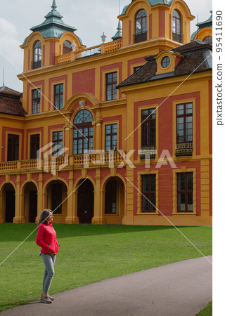 Beautiful Girl Posing Near Favorite Palace At Ludwigsburg, Germany. Favorite Castle Is The Oldest German Porcelain Castle Near The Village Of Forch Near Rastatt. Schloss Favorite, Baden-Wuerttemberg. 95411690