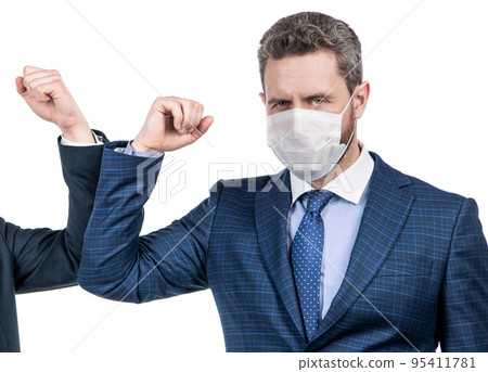 Man manager in mask use coronavirus greeting touching elbows with colleague, elbow bumping 95411781