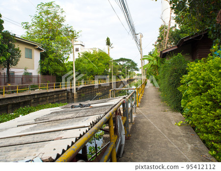 Walk way along the drainage canal 95412112