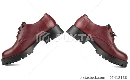 Brogue shoes for teenagers with thick soles and laces on a white background. 95412188
