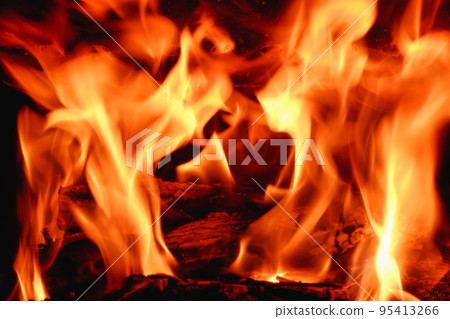 Fire in the fireplace close-up on a long exposure. Background. 95413266