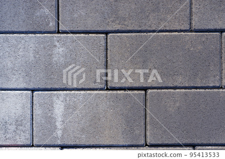 Vibro-pressed concrete paving slabs. Pattern of rectangles, bricks. Texture of road tiles Vibro-pressed concrete paving slabs. Pattern of rectangles, bricks. Texture of road tiles 95413533