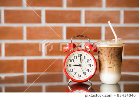 9 o'clock times for iced coffee concept. retro bell clock with ice latte coffee. 95414046