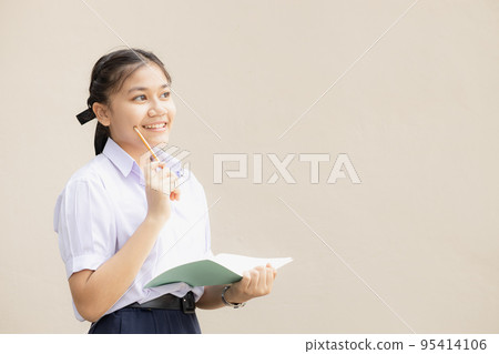 Asian student in high school uniform thinking gesture happy smile with creative with space for text 95414106