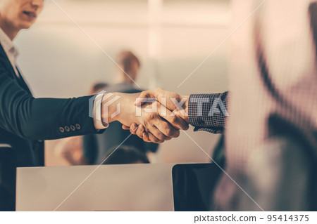 close up. Manager shaking the hand of the Bank customer close up. Manager shaking the hand of the Bank customer 95414375