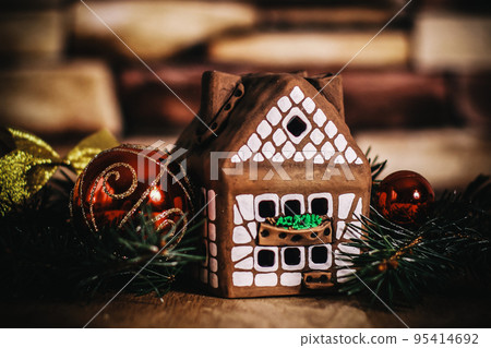 gingerbread house,Christmas balls. the concept of the celebrati gingerbread house,Christmas balls. the concept of the celebrati 95414692