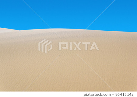 desert landscape, sand dunes under blue sky 95415142