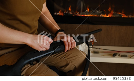 Gunsmith cleaning gun rifle assemble dismantle maintenance. Opening of the spring hunting season. A man cleans rifle aim, maintenance before hunting. Close up on hands with fireplace on background Gunsmith cleaning gun rifle assemble dismantle maintenance. Opening of the spring hunting season. A man cleans rifle aim, maintenance before hunting. Close up on hands with fireplace on background 95415388