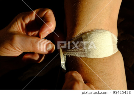 Band aid is removed after injection by old womans hands of nurse. Blood stain, the bandage after injection . Man arm , medical concept bundage removing 95415438