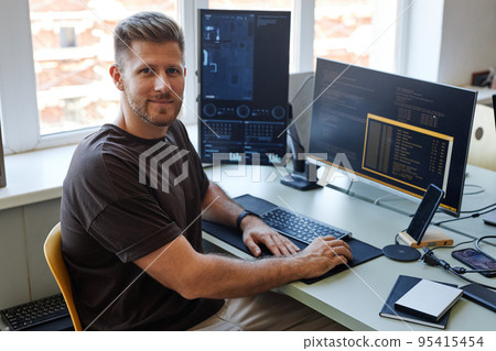 Computer Programmer Smiling at Camera Computer Programmer Smiling at Camera 95415454