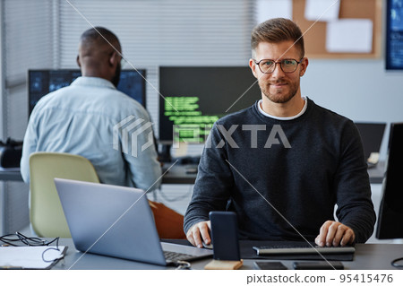 Man Working in Software Development Company Man Working in Software Development Company 95415476