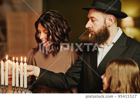 Jewish Family Lighting Menorah 95415527